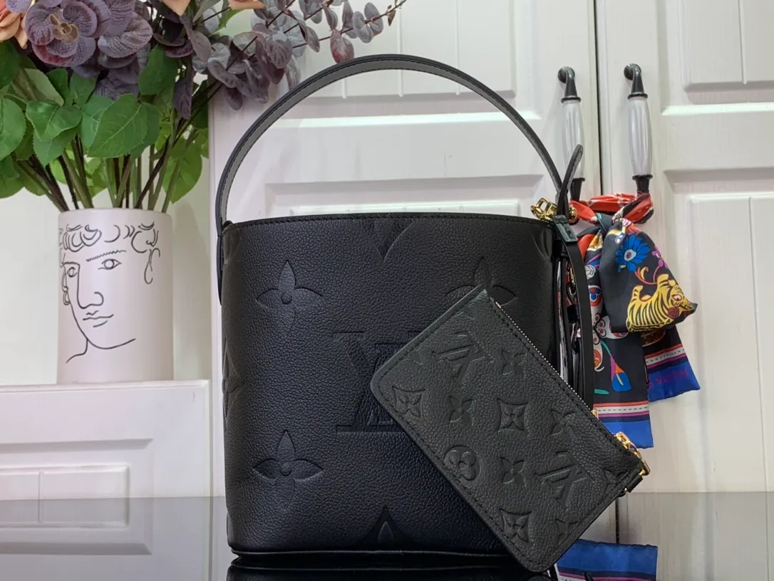 CarryAll MM Monogram Empreinte Leather Handbags