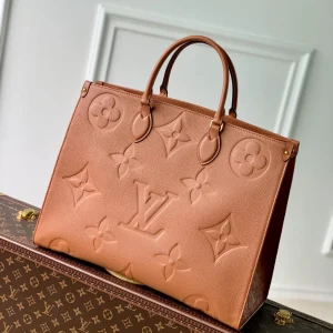 OnTheGo MM Monogram Empreinte Leather Handbags