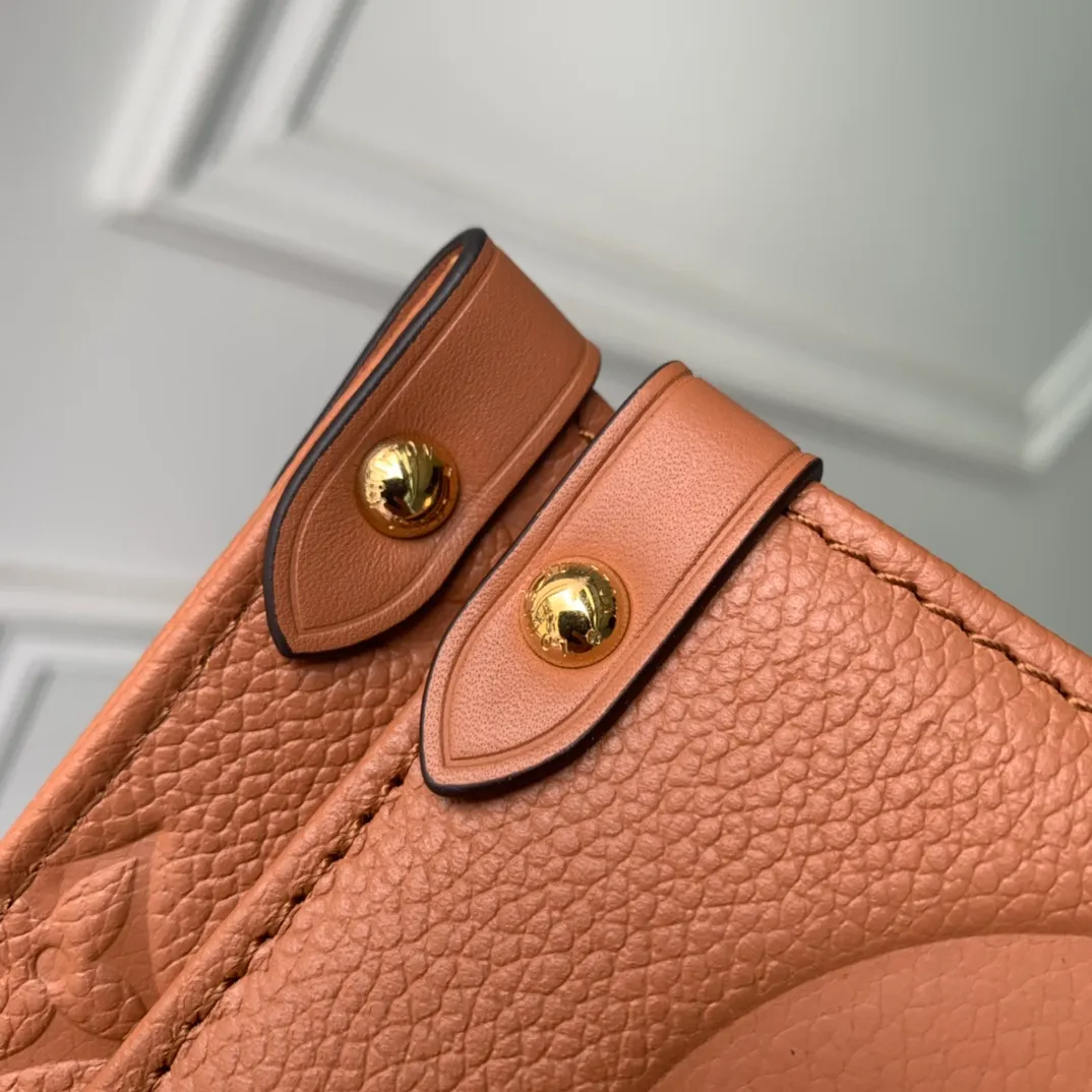 OnTheGo MM Monogram Empreinte Leather Handbags - Image 7