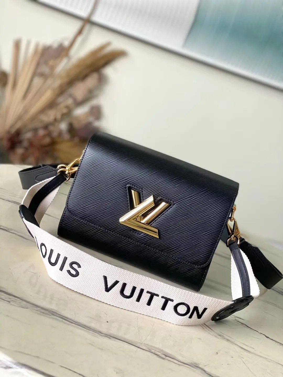 Twist MM Epi Leather Handbags
